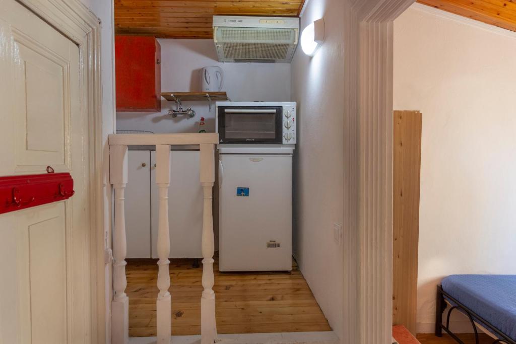 A kitchen or kitchenette at Studio attic in Corfu Town centre