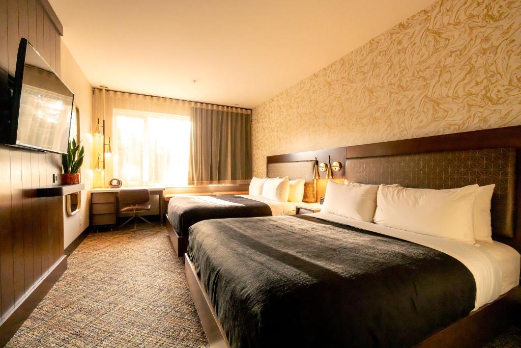 Postel nebo postele na pokoji v ubytování Hotel Zed Tofino