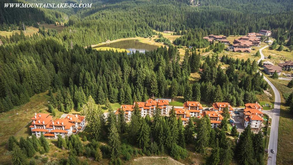 an aerial view of a resort in a forest at Апартамент Liora in Smolyan