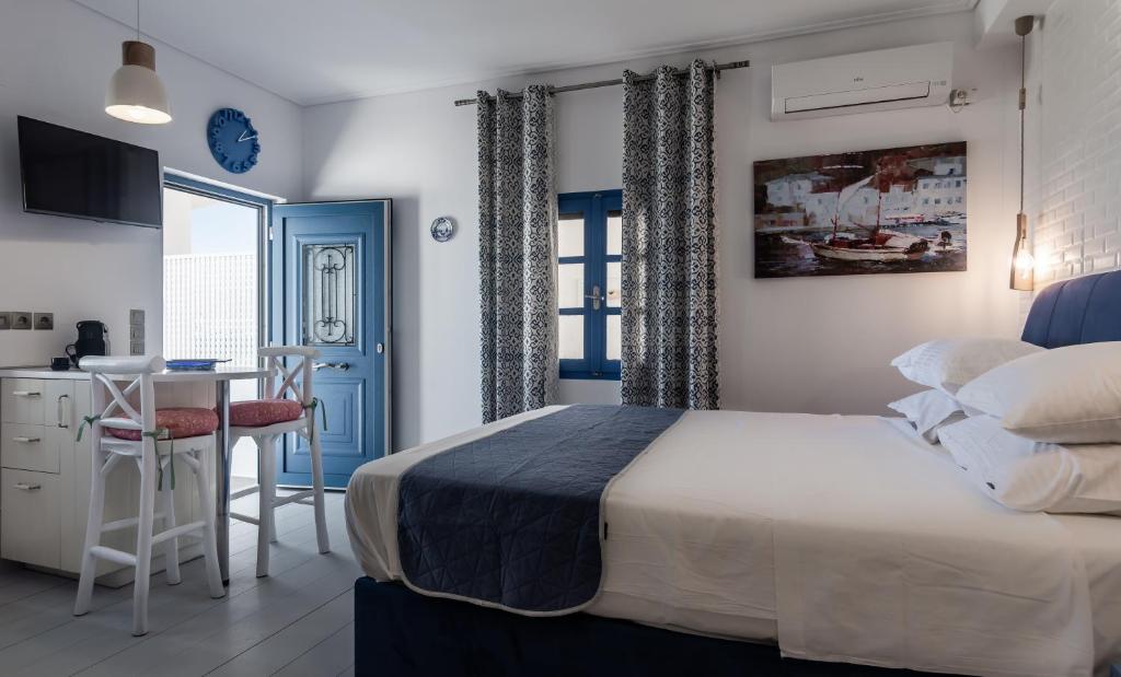 A bed or beds in a room at APOLLON by Akroploro