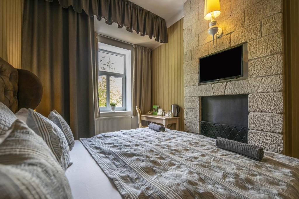 TV a/nebo společenská místnost v ubytování Oxigén Family Hotel Noszvaj