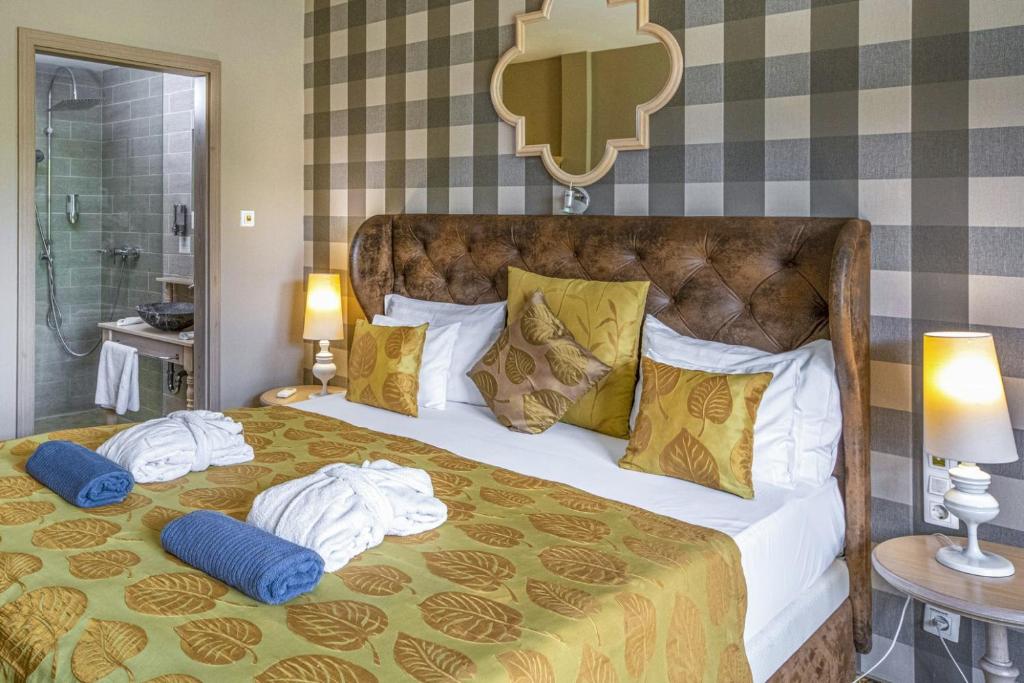 Postel nebo postele na pokoji v ubytování Oxigén Family Hotel Noszvaj