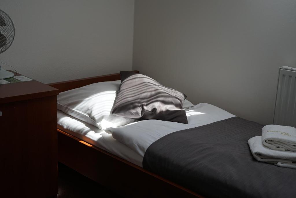 Postel nebo postele na pokoji v ubytování Pivovarský Hotel