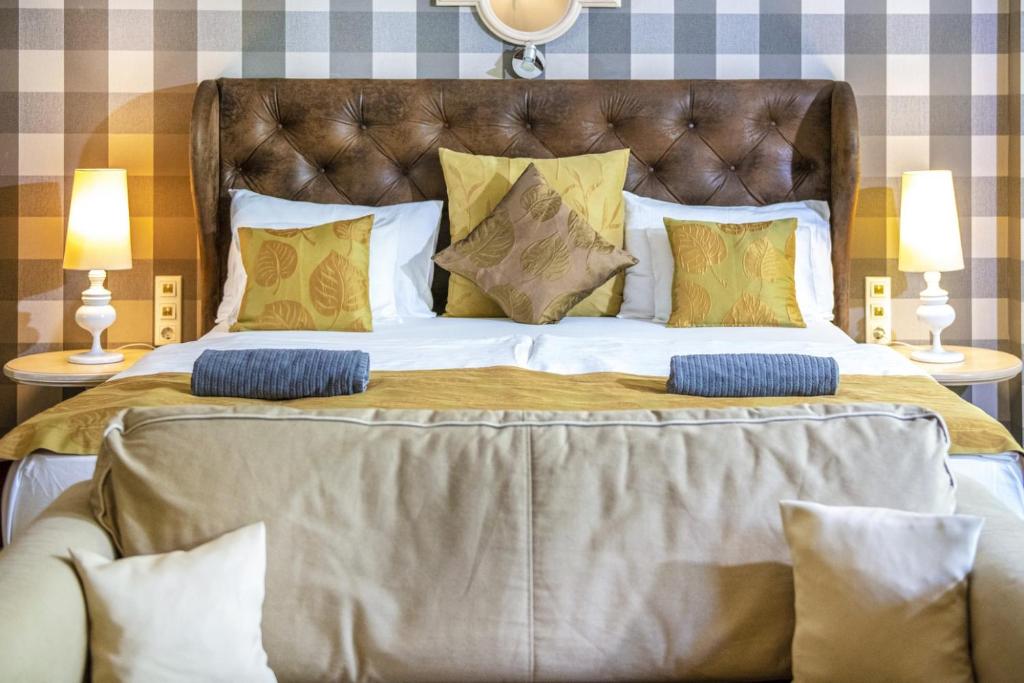 Postel nebo postele na pokoji v ubytování Oxigén Family Hotel Noszvaj