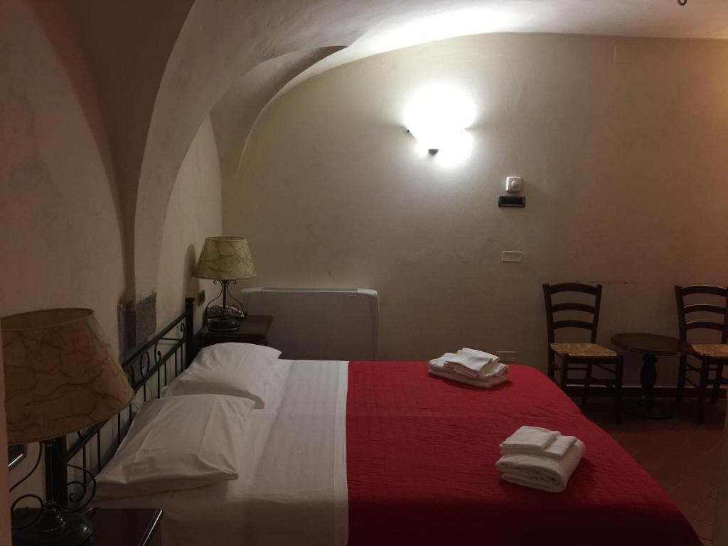 Postel nebo postele na pokoji v ubytování Hotel Le Due Fontane