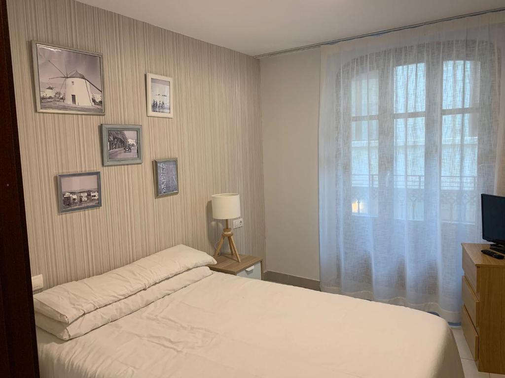 Ein Bett oder Betten in einem Zimmer der Unterkunft Plaza Negrito Apartments