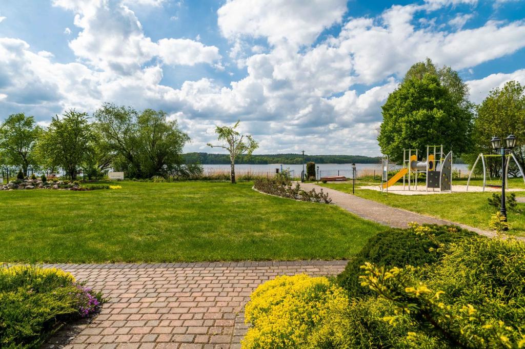 a park with a playground and a playground at PARADISE Apartamenty in Charzykowy