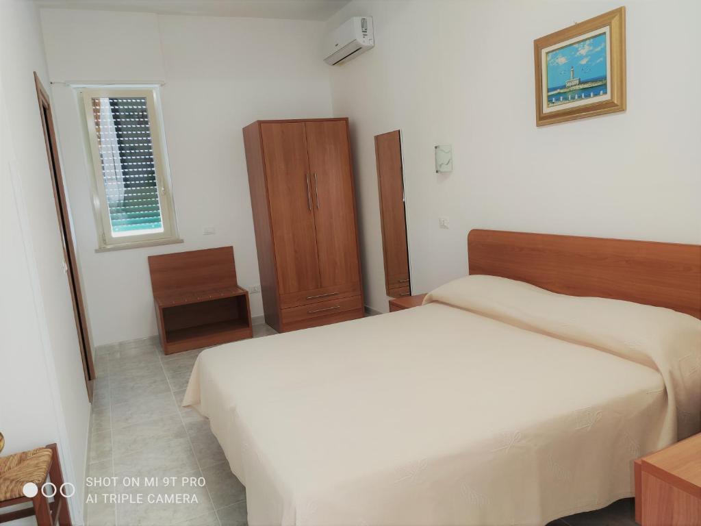 Postel nebo postele na pokoji v ubytování Hotel Ponte