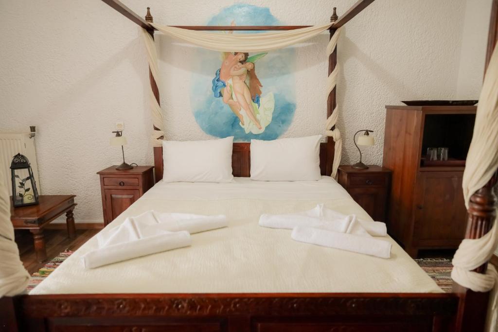 Posteľ alebo postele v izbe v ubytovaní Akrotiri B&B