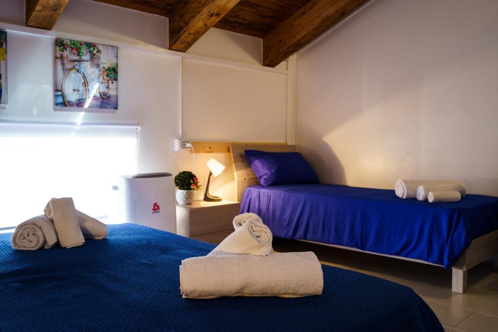 Postel nebo postele na pokoji v ubytování Sansi´s Sapri Camere