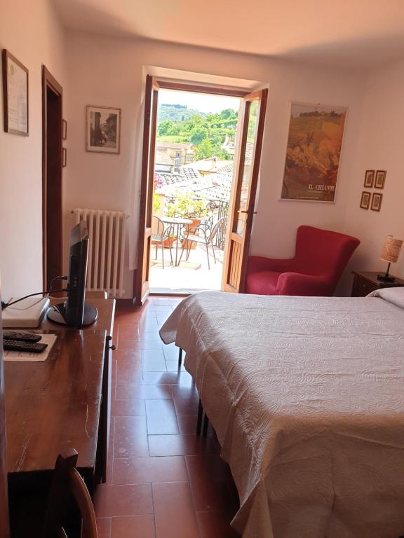 Posteľ alebo postele v izbe v ubytovaní Albergo Giovanni Da Verrazzano