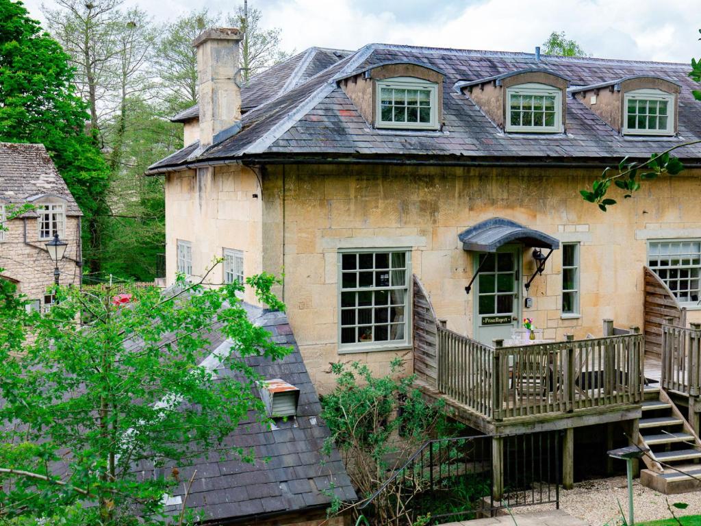 an old house with a porch and a balcony at Prince Rupert in Winchcombe