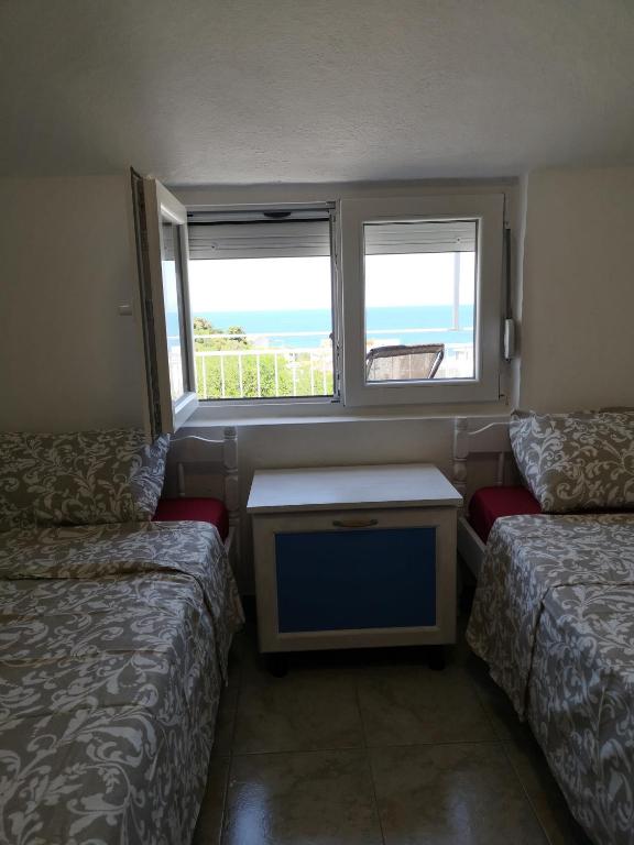 Postel nebo postele na pokoji v ubytování Apartman Kosta