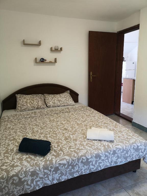 Postel nebo postele na pokoji v ubytování Apartman Kosta