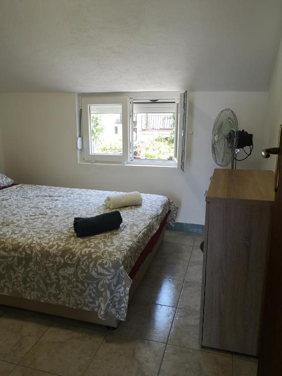 Postel nebo postele na pokoji v ubytování Apartman Kosta