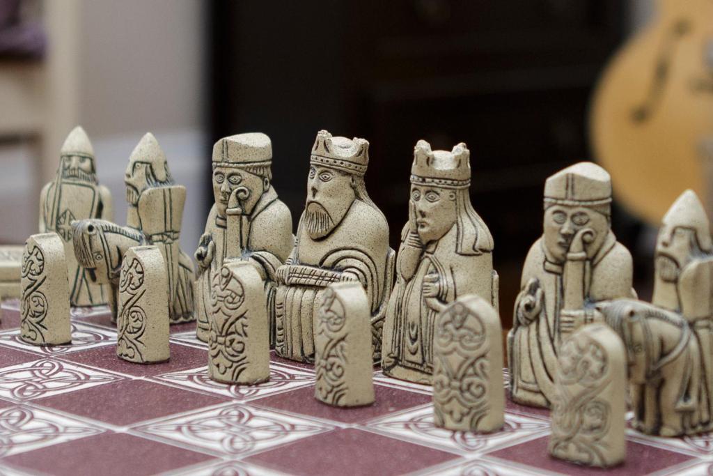 a group of wooden figurines on a table at The Dragonfly in Stornoway