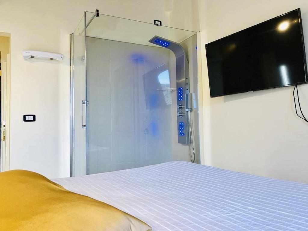 Televízia a/alebo spoločenská miestnosť v ubytovaní Mavitur Rooms Assisi