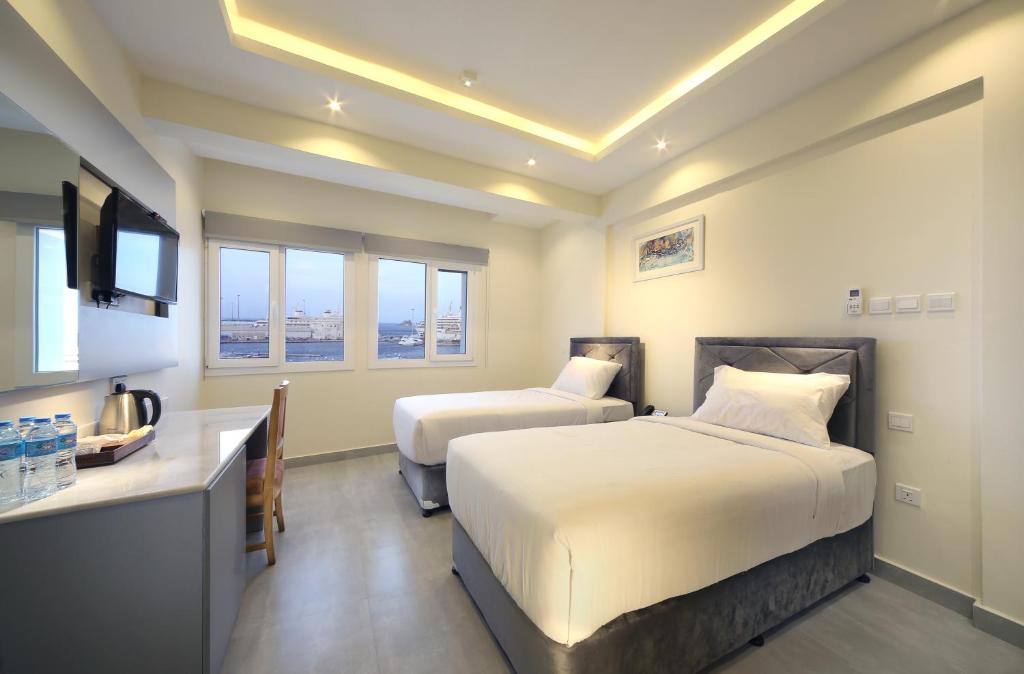 Postel nebo postele na pokoji v ubytování NASEEM HOTEL