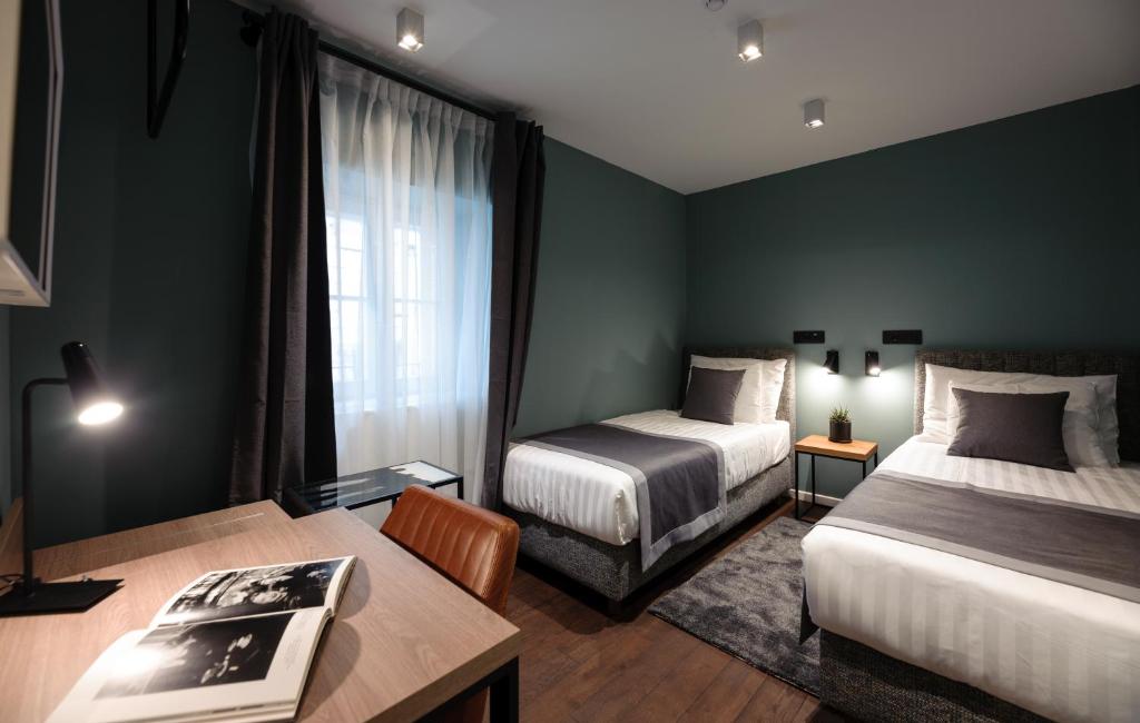 Postel nebo postele na pokoji v ubytování Camera Hotel