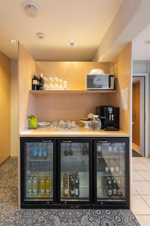 Kuchyň nebo kuchyňský kout v ubytování Bären Self Check-in Hotel