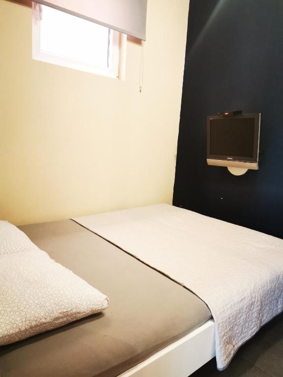 Postel nebo postele na pokoji v ubytování Nest