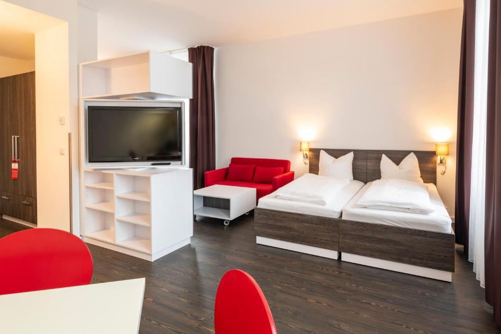 Postel nebo postele na pokoji v ubytování Boardinghaus Weinberg Campus