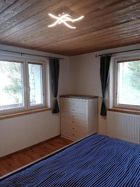 Postel nebo postele na pokoji v ubytování Apartmány ALLISS Harrachov