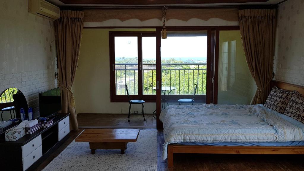Postel nebo postele na pokoji v ubytování Jun House