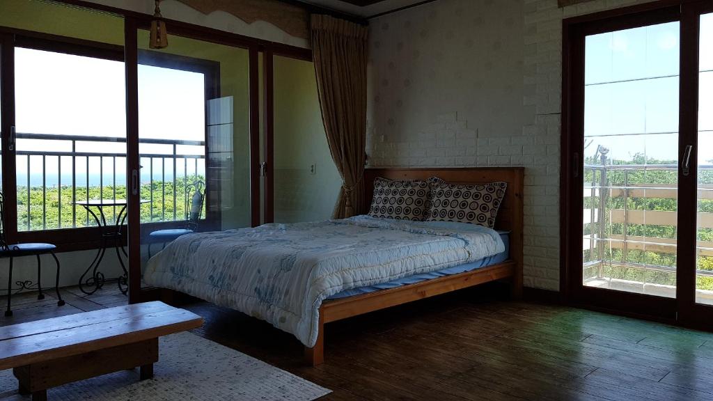 Postel nebo postele na pokoji v ubytování Jun House