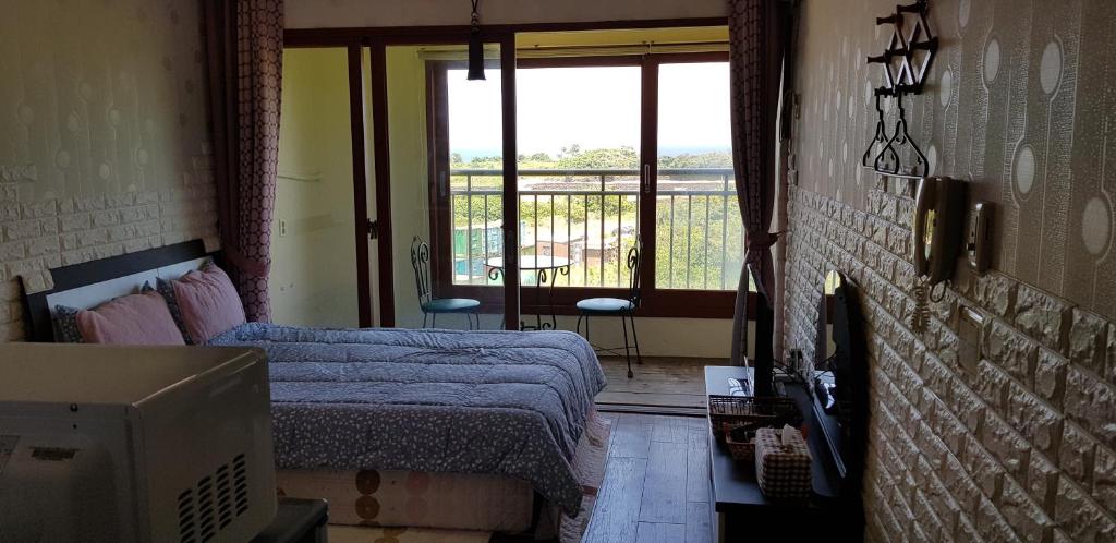 Postel nebo postele na pokoji v ubytování Jun House