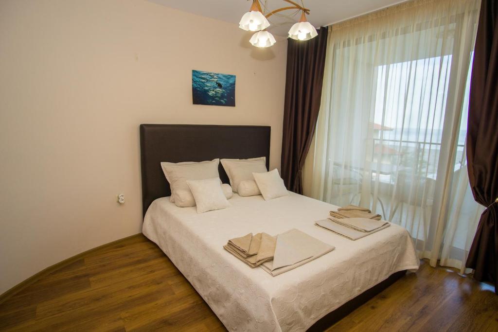 Postel nebo postele na pokoji v ubytování Guest apartments STELA