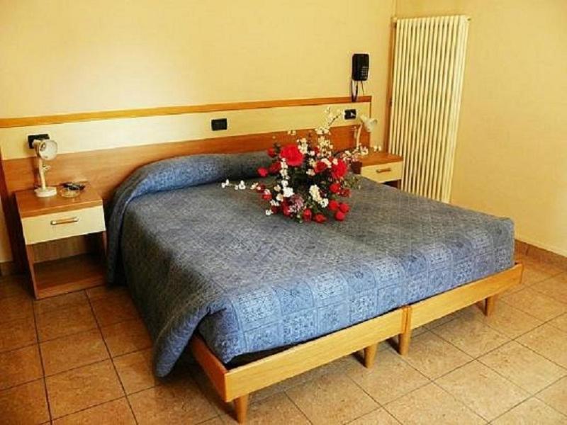 Postel nebo postele na pokoji v ubytování Hotel Amba Alagi