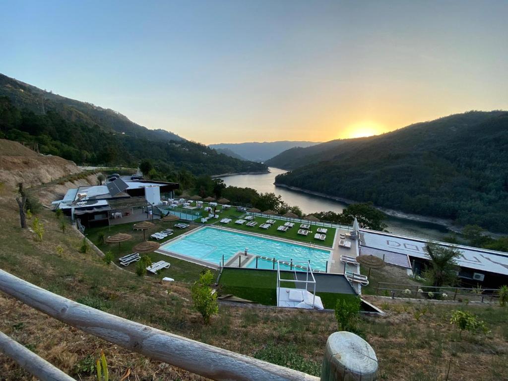 a view of a river with a swimming pool at DOBAU village in Vieira do Minho