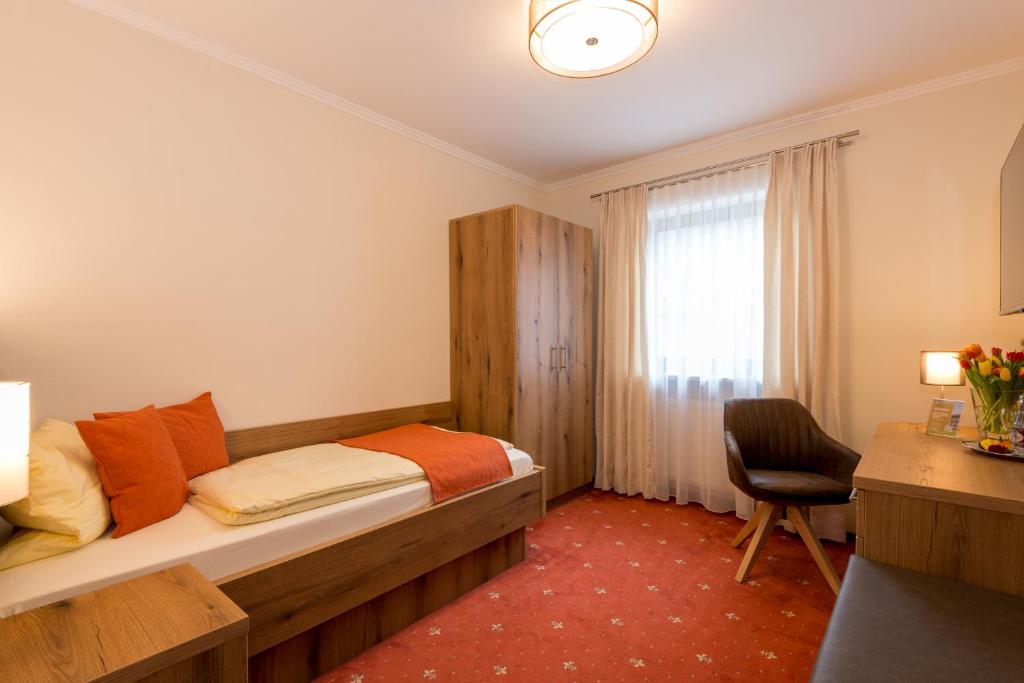 Postel nebo postele na pokoji v ubytování Hotel Sonnbichl