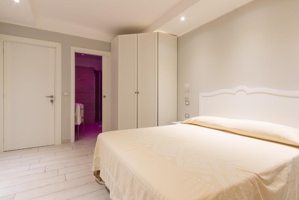 Postel nebo postele na pokoji v ubytování Domu Ajaju Guest House