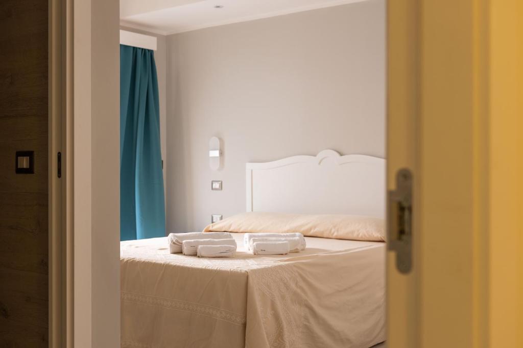 Postel nebo postele na pokoji v ubytování Domu Ajaju Guest House