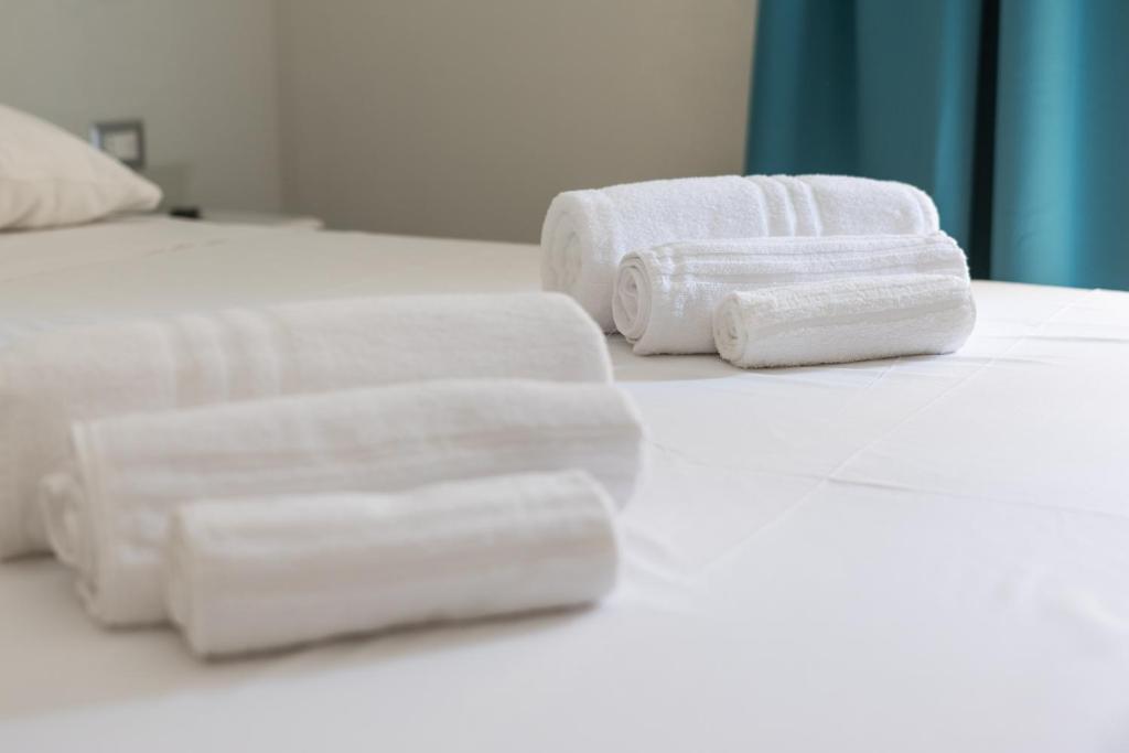 Postel nebo postele na pokoji v ubytování Domu Ajaju Guest House