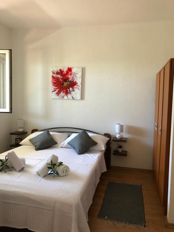 Postel nebo postele na pokoji v ubytování Apartments Mira