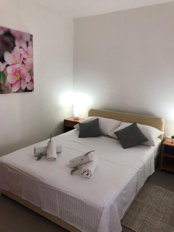 Postel nebo postele na pokoji v ubytování Apartments Mira