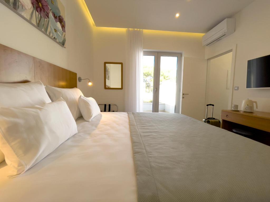 Posteľ alebo postele v izbe v ubytovaní Beach Residences Caroline