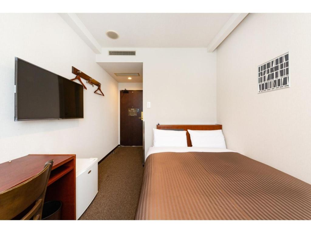 The One Five Marine Fukuoka - Vacation STAY 40105v tesisinde bir odada yatak veya yataklar