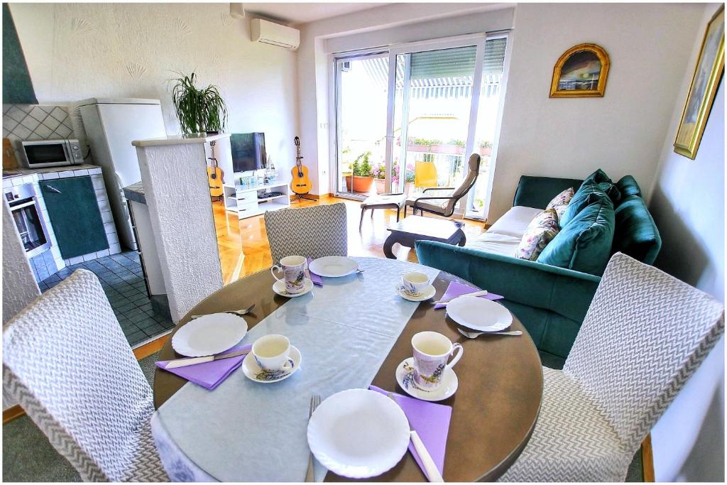 a living room with a dining table and a living room at Apartment Balcony in Split