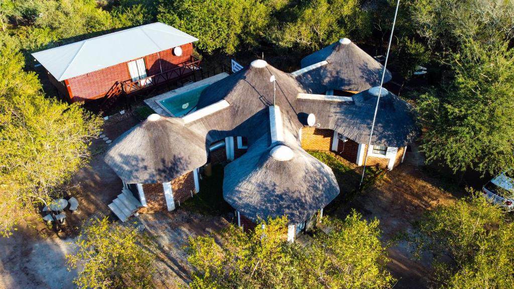 an aerial view of a house with a swimming pool at Nanisto Bush Lodge in Marloth Park