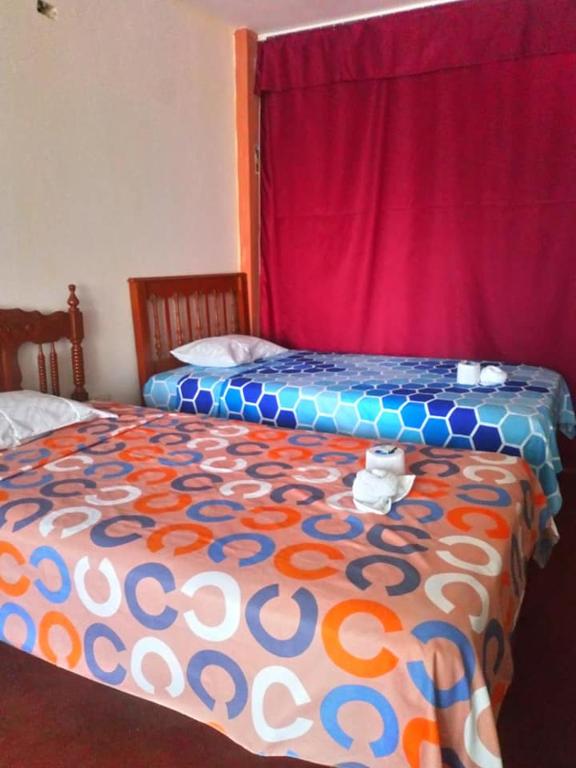 Postel nebo postele na pokoji v ubytování Inti Hostel Airport