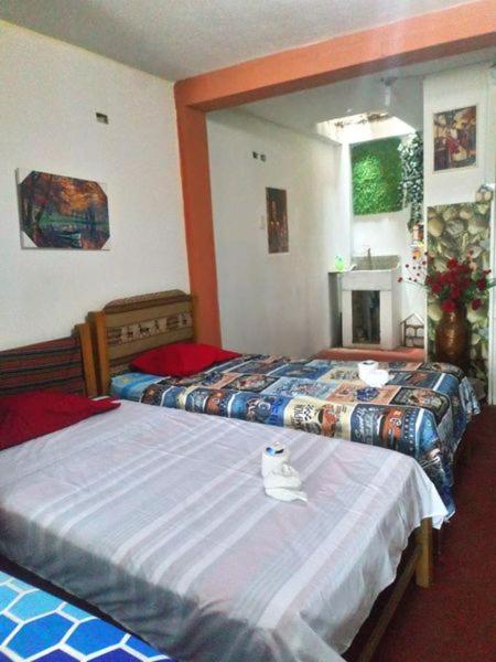 Postel nebo postele na pokoji v ubytování Inti Hostel Airport