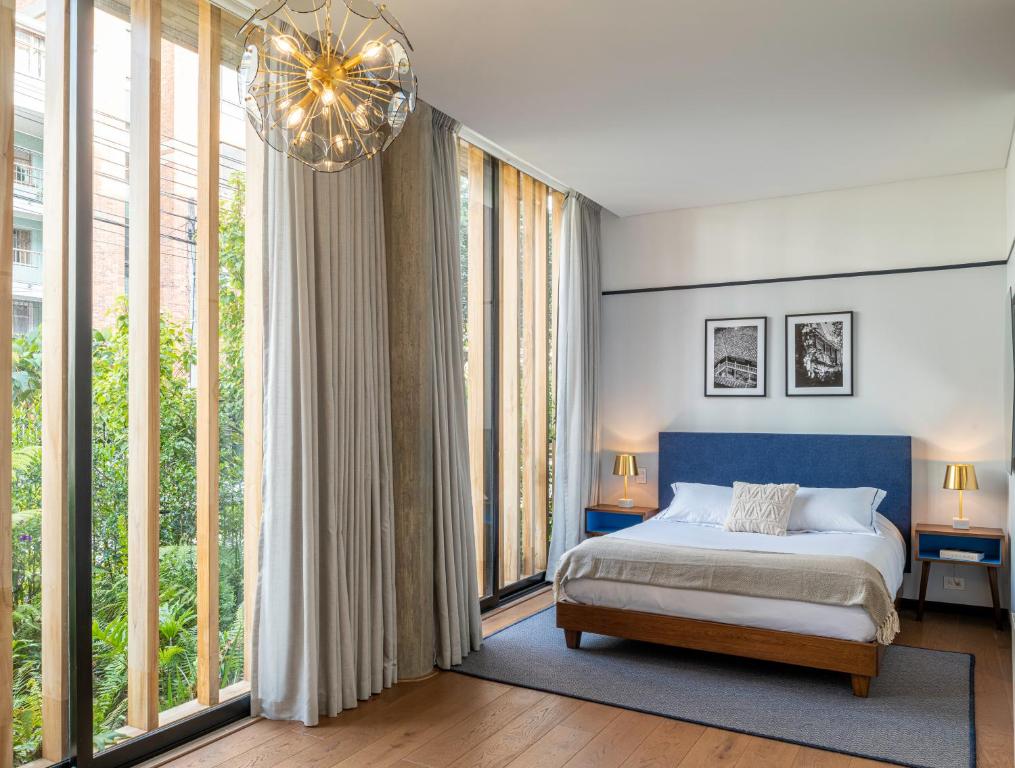 Postel nebo postele na pokoji v ubytování HAB Hotel Bogotá