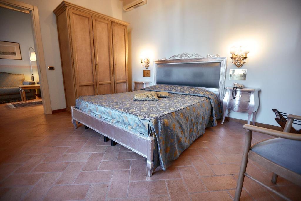 Posteľ alebo postele v izbe v ubytovaní Hotel Villa Il Patriarca