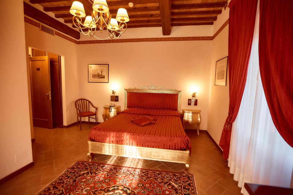 Posteľ alebo postele v izbe v ubytovaní Hotel Villa Il Patriarca