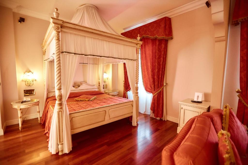 Posteľ alebo postele v izbe v ubytovaní Hotel Villa Il Patriarca