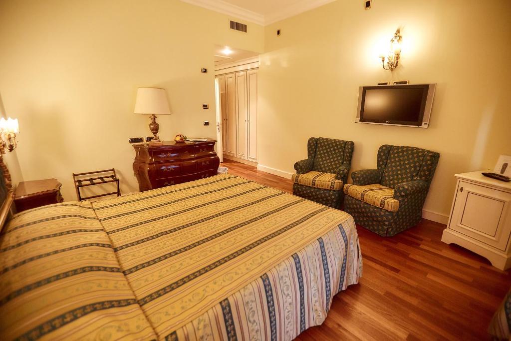 Posteľ alebo postele v izbe v ubytovaní Hotel Villa Il Patriarca